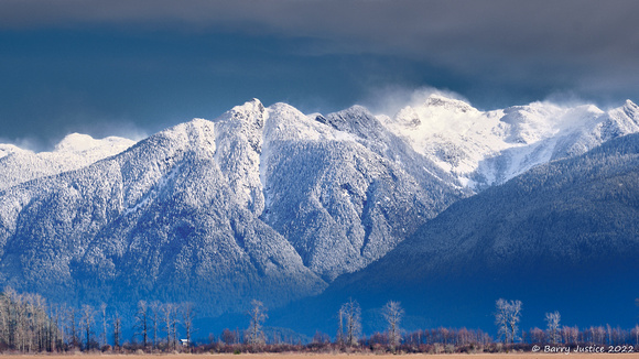 New Snow on the Mountains behind Pitt Lake