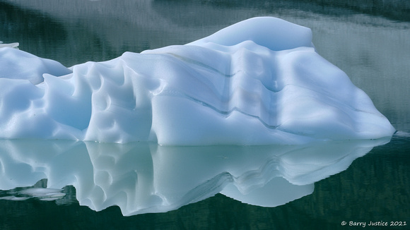 An iceberg floating in the small lake below Edith Cavell Glacier in Jasper National Park